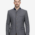 Model wearing Bavarian festival jacket for men front view featuring traditional wool fabric, alpine buttons and classic Trachten styling.