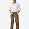Front view of model wearing Bavarian Long Lederhosen Pants in rustic brown leather with classic five pocket styling