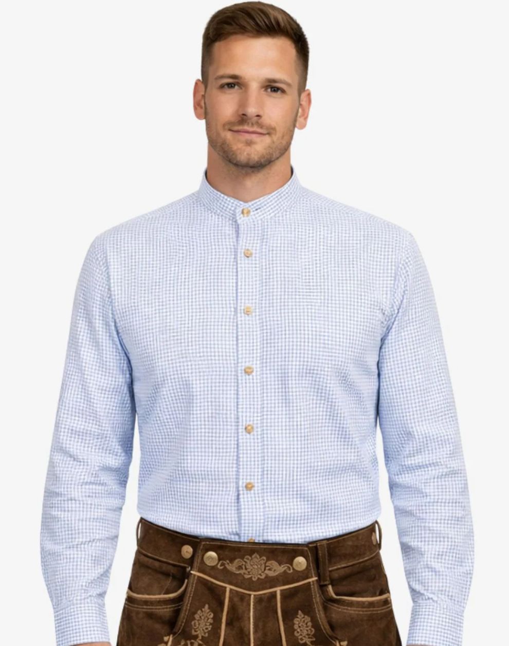 Man wearing a light blue checkered shirt and brown traditional pants on a white background