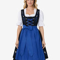 Front view of Bavarian style dirndl for women worn by model featuring blue apron, lace blouse and traditional alpine fit