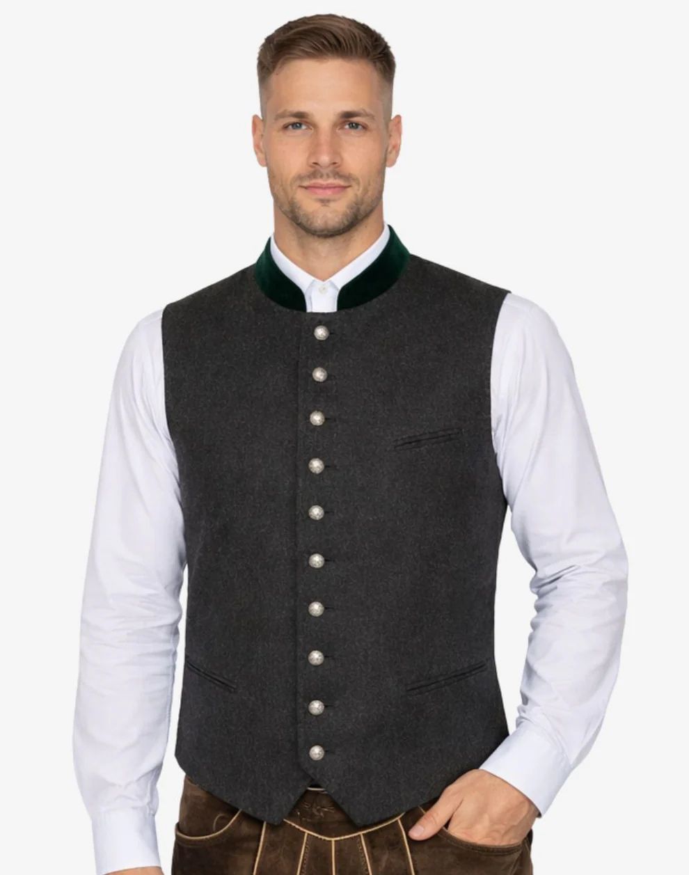 Man wearing a dark gray vest over a white shirt on a white background