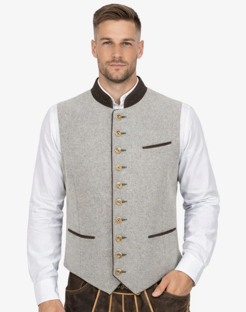 Man wearing a gray vest with gold buttons over a white shirt on a white background