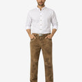 Man wearing a white shirt and brown pants on a white background