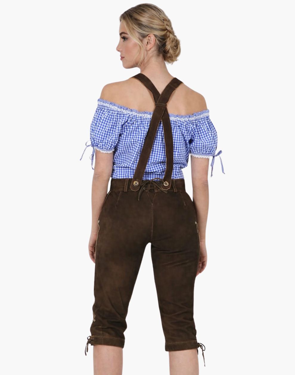 Woman wearing a blue checkered top and brown lederhosen on a white background