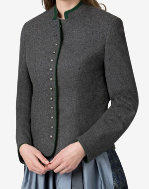 Close-up front view of a women’s charcoal grey traditional Bavarian trachten jacket with green trim, metal button detailing, and tailored fit, worn over a dirndl dress.