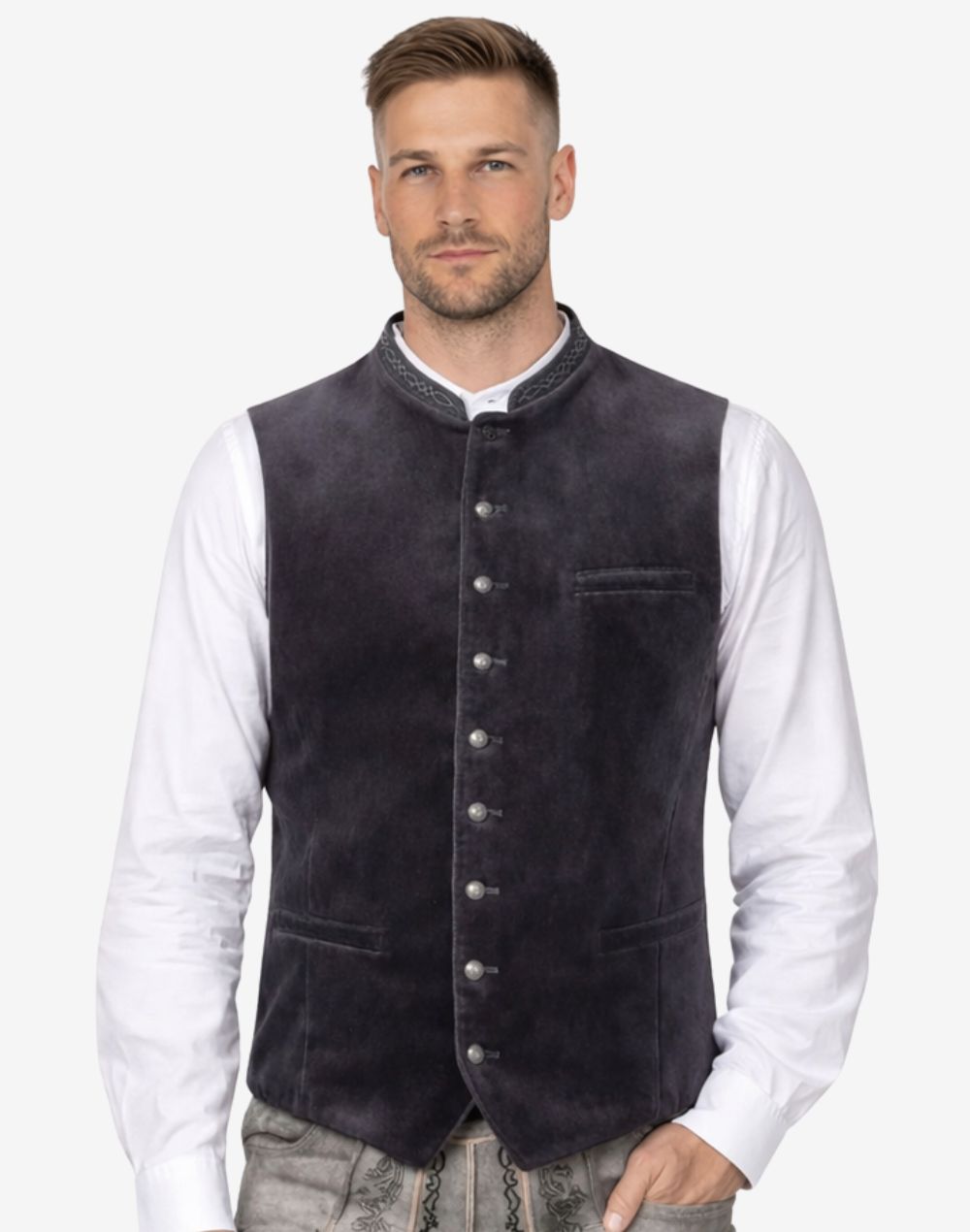 Model wearing charcoal velvet Bavarian vest for men paired with white shirt and lederhosen showcasing authentic Oktoberfest style.