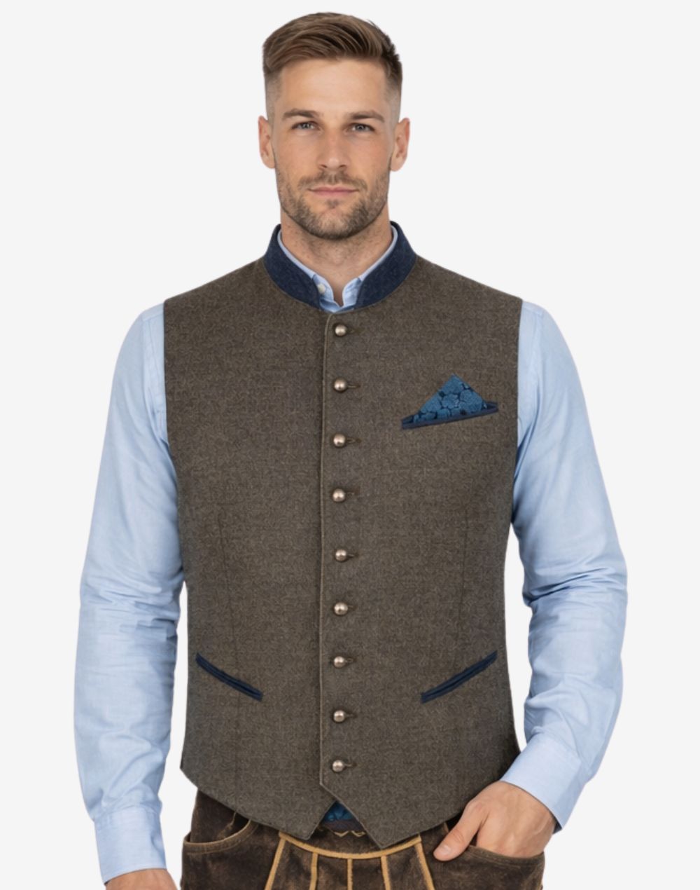 Male model wearing Classic Alpine Trachten vest paired with Bavarian shirt and traditional Lederhosen outfit styled for Oktoberfest festivals and German heritage clothing.