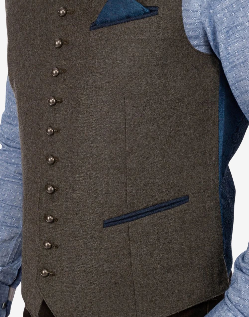 Side close-up of Classic Alpine Trachten vest showing textured brown wool fabric, blue trimmed pocket detail and traditional Bavarian metal button craftsmanship.