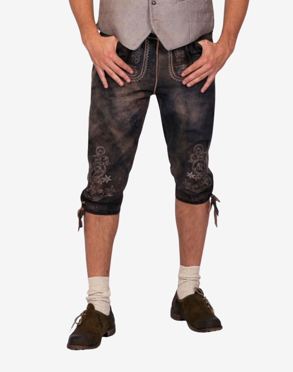 Front wearing view of classic Bavarian bundhosen shorts displaying decorative embroidery, belt buckle and traditional fit