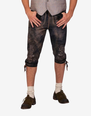 Front wearing view of classic Bavarian bundhosen shorts displaying decorative embroidery, belt buckle and traditional fit