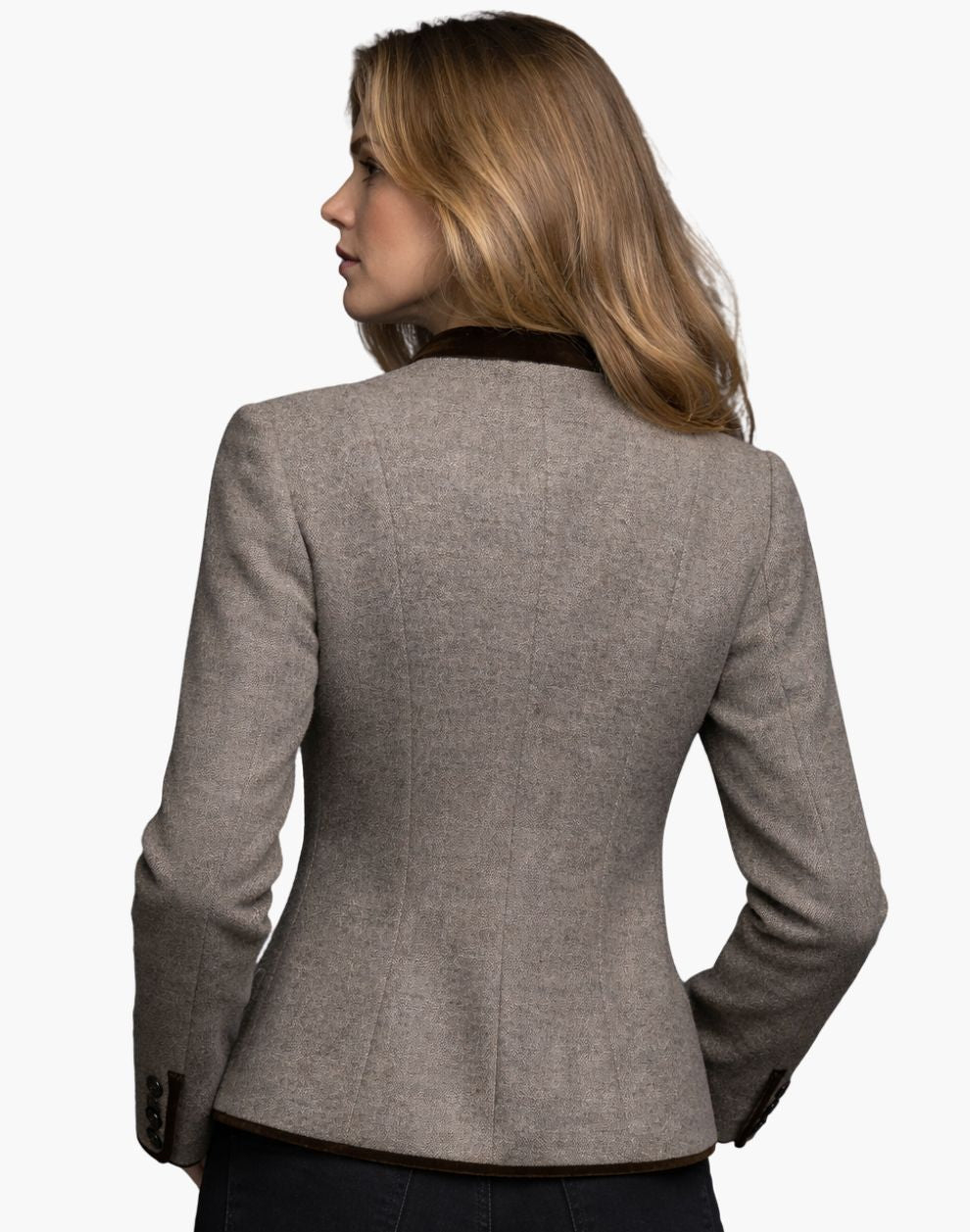 Woman wearing a gray blazer on a white background