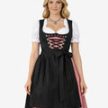 Front view of classic black Oktoberfest dirndl dress featuring lace-up bodice, pink gingham panel and traditional apron bow