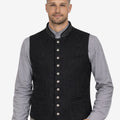 Male model wearing classic black wool Bavarian vest paired with traditional attire, ideal for Oktoberfest and formal Alpine occasions.