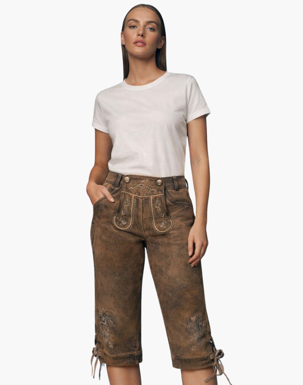 Woman wearing a white t-shirt and brown distressed pants on a white background