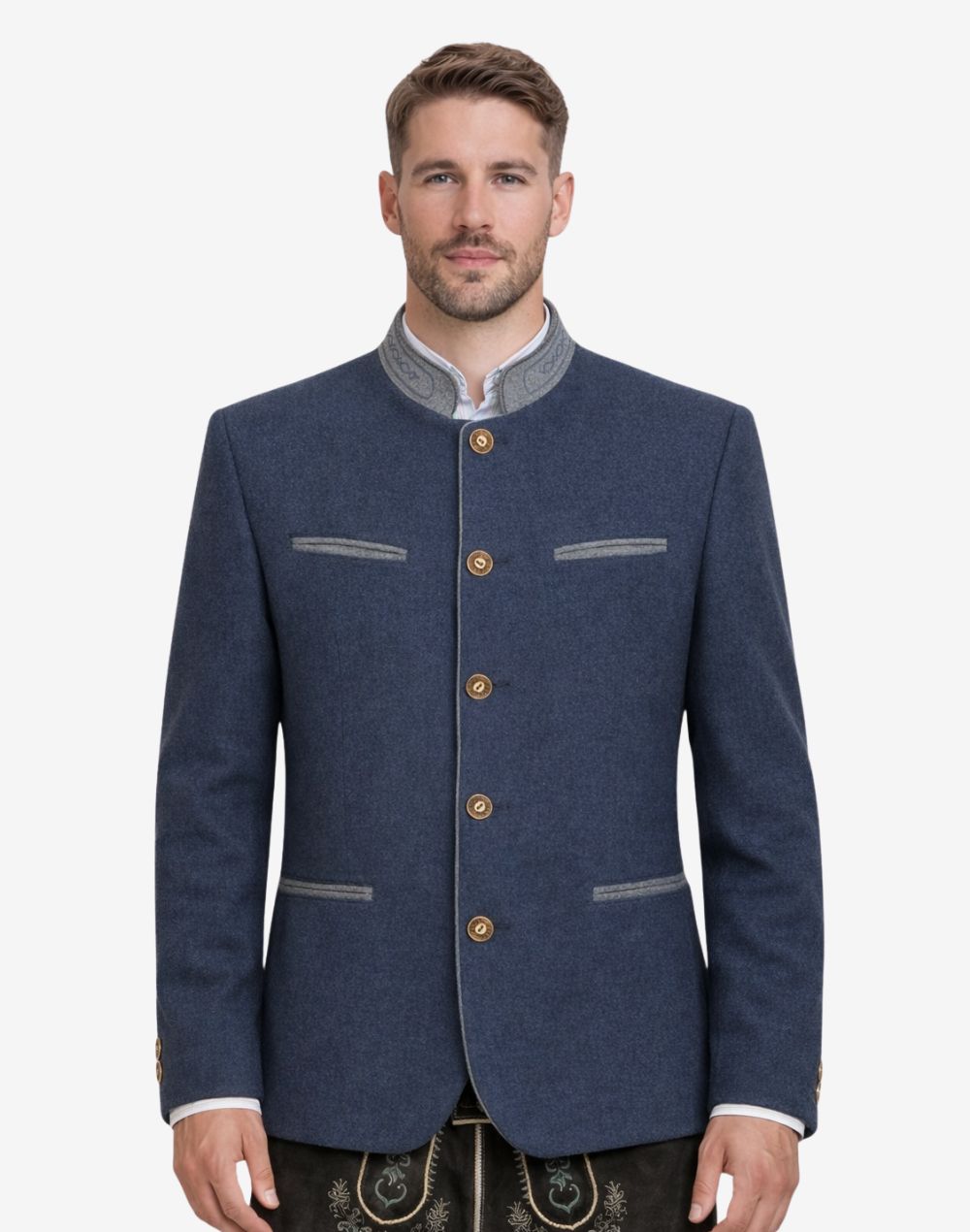 Model wearing classic navy blue Trachten jacket with traditional Bavarian details, paired with lederhosen for authentic Oktoberfest outfit and heritage styling.