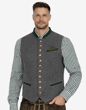Model wearing classic trim mens gray Bavarian vest paired with traditional outfit, ideal for Oktoberfest and Alpine occasions.