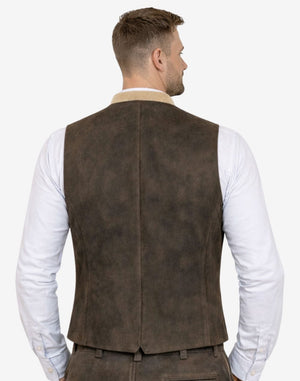 Rear view of model wearing dark brown suede Trachten vest highlighting fitted cut and traditional Bavarian design.