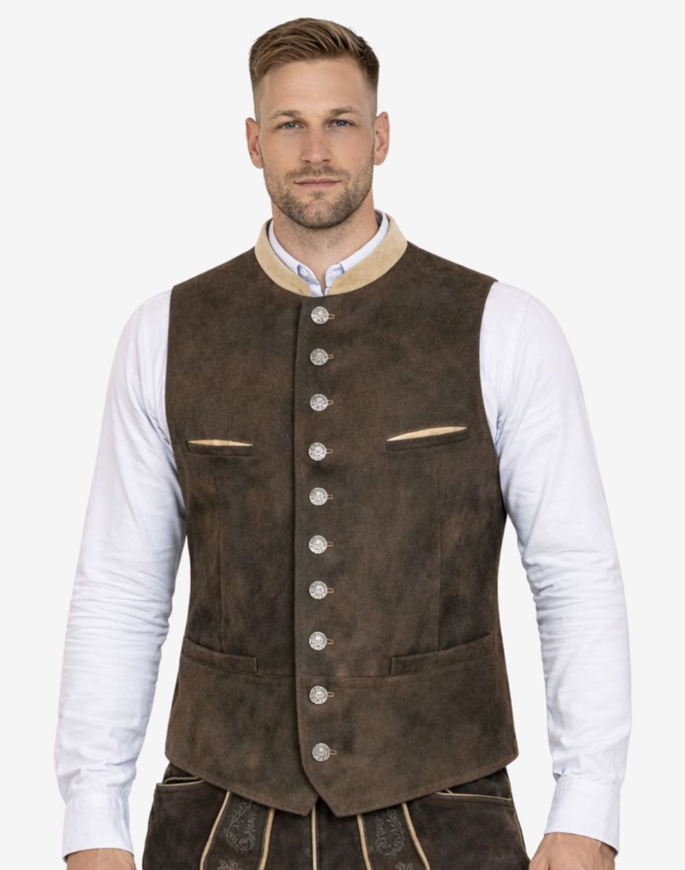 Model wearing dark brown suede Bavarian Trachten vest paired with white shirt and lederhosen for Oktoberfest outfit.