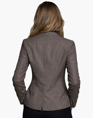 Brown blazer worn by a person on a white background