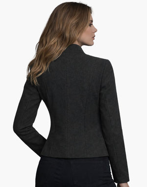 Woman wearing a dark gray blazer on a white background