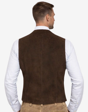 Rear view of model wearing embroidered suede Trachten vest displaying fitted silhouette, smooth back panel, high quality craftsmanship and authentic Bavarian Oktoberfest traditional menswear styling.