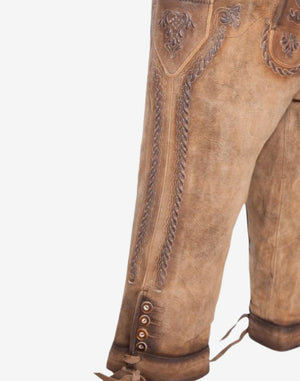Side detail view of festival ready bundhosen emphasizing leg embroidery, decorative buttons and classic Bavarian leather craftsmanship