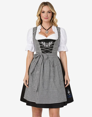 Front view of festival ready dirndl dress worn by model featuring check apron, lace blouse and classic Bavarian fit style