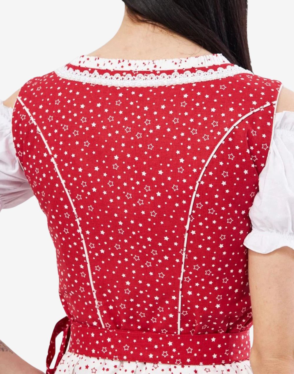 Back detail view of dirndl dress showing red patterned fabric, waist seam structure and traditional Bavarian stitching finish