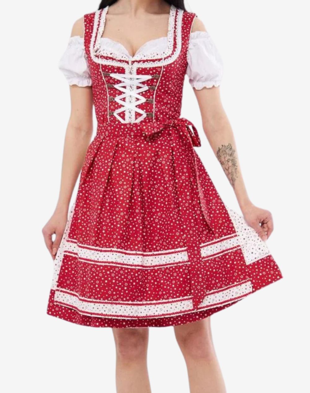 Front view of festival ready dirndl dress worn by model showing red floral fabric, white lace trim, apron bow and classic fit