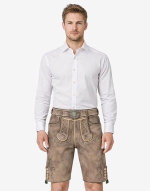 Model wearing genuine leather lederhosen for men in traditional Bavarian style with decorative embroidery and belt buckle