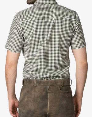 Person wearing a green and white checkered shirt with brown pants on a white background