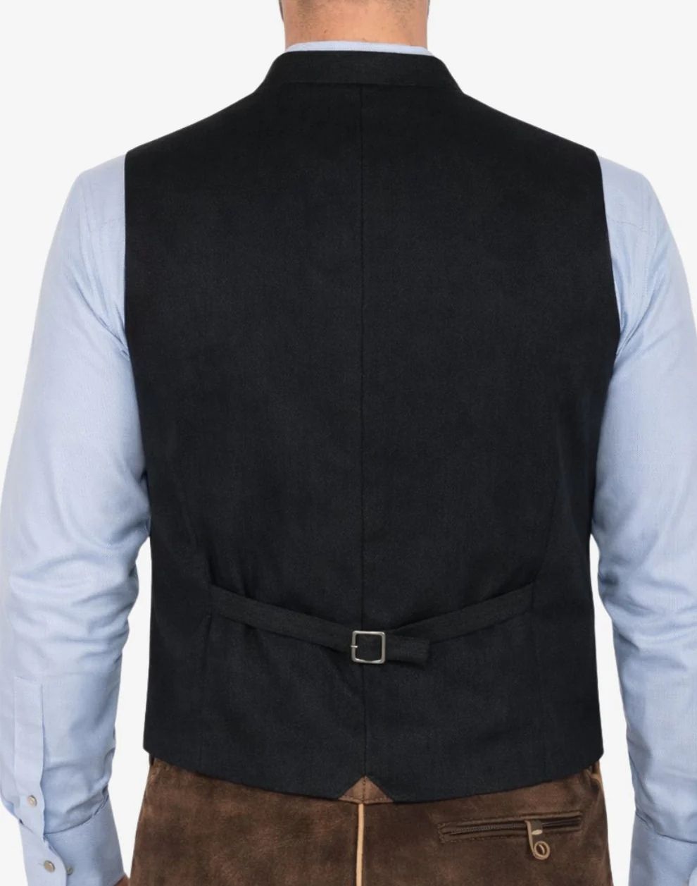 Black vest worn by a person on a plain background