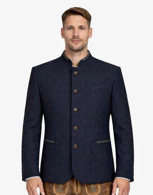Man wearing a navy blazer with brown buttons on a white background