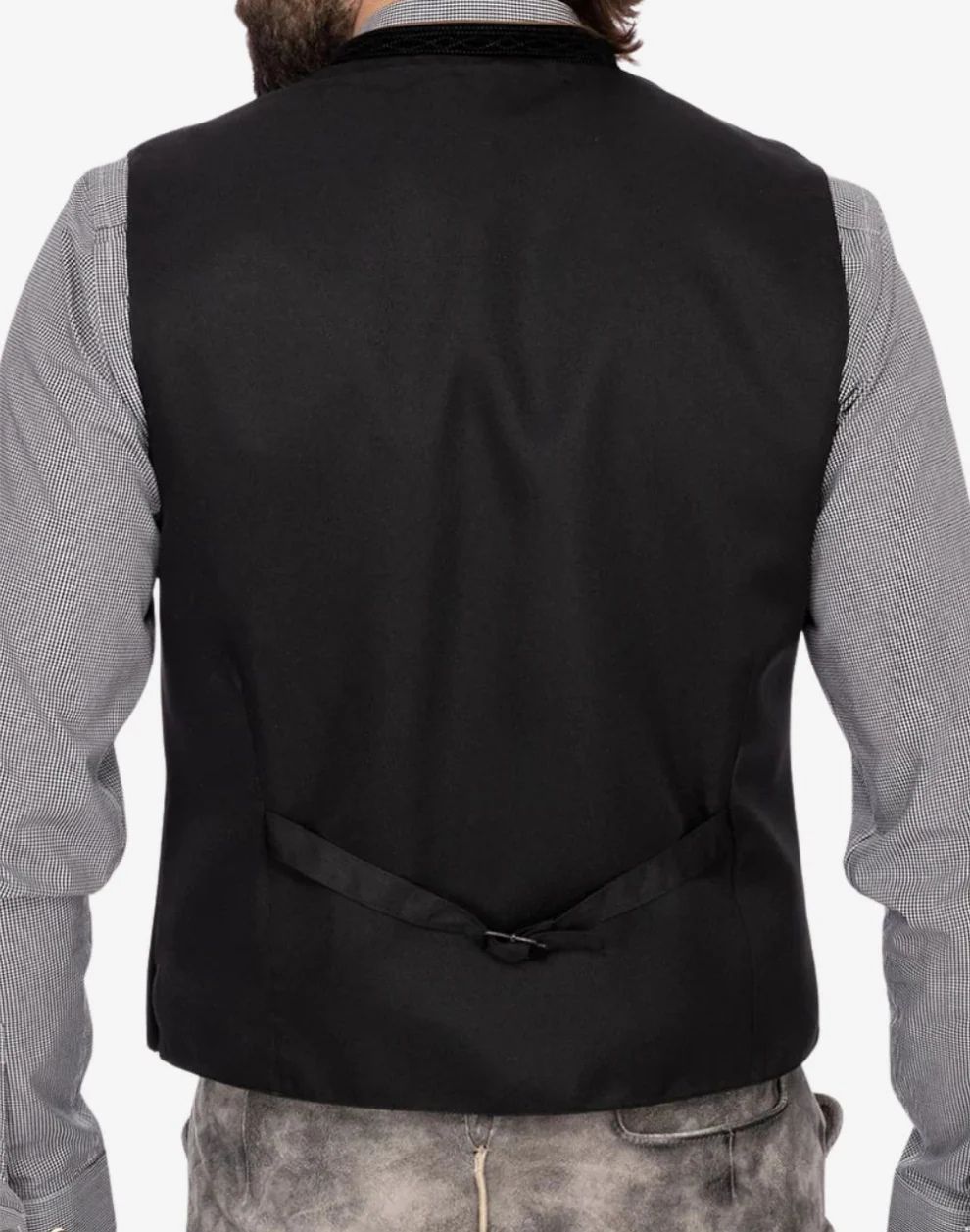 Black vest worn by a person on a white background