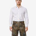 Model wearing German traditional lederhosen for men in brown leather with blue Bavarian embroidery and belt buckle