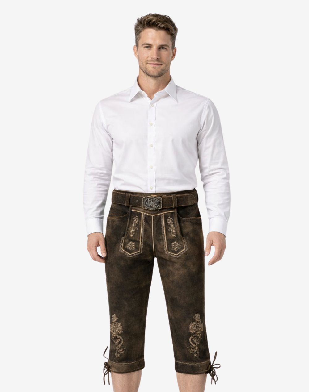 Front view of model wearing handmade Bavarian Bundhosen for men in dark brown leather with traditional embroidery and knee tie details