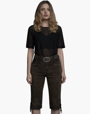 Woman wearing a black sheer top and brown shorts on a white background
