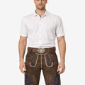 Front view of model wearing Heritage Line Lederhosen for Men in brown leather with traditional Bavarian embroidery and belt buckle