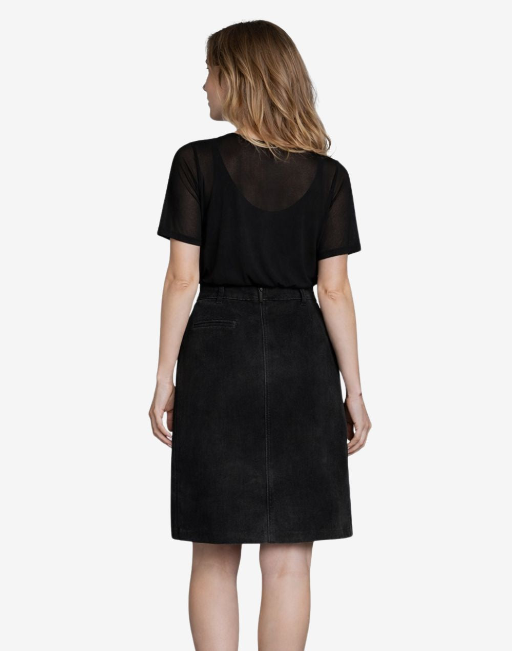Back view of women's black high-rise A-line skirt with leather-look finish and center back seam detail, paired with a sheer short-sleeve black top.