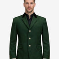 Front view of model wearing Luxury Bavarian Trachten Jacket in deep green with black velvet collar and silver buttons