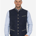 Front view of model wearing Luxury Bavarian Trachten Vest in navy fabric with decorative silver buttons and contrast trim