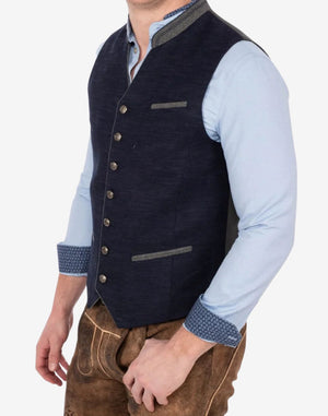 Side angle of model wearing luxury Bavarian trachten vest highlighting structured fit, textured fabric and traditional styling