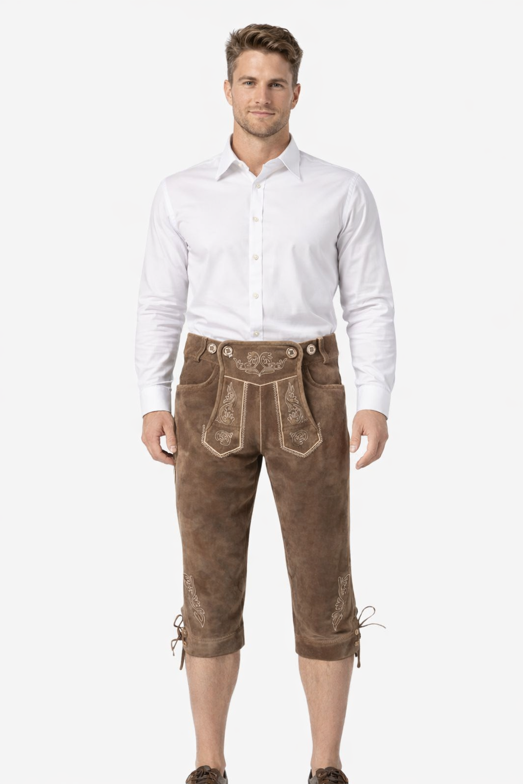 Front view of model wearing luxury leather Bundhosen for men in brown with Bavarian embroidery and traditional Oktoberfest knee tie design