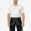 Front view of model wearing Men Black Trachten Lederhosen in black leather with Bavarian embroidery and traditional belt buckle