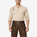 Front view of model wearing Men Festday Classic Lederhosen in brown leather with Bavarian embroidery and traditional belt buckle