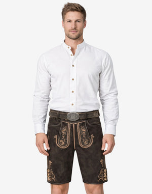 Model wearing suede charcoal lederhosen for men in dark leather with traditional Bavarian embroidery and belt buckle