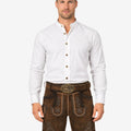 Model wearing vintage brown lederhosen for men with traditional Bavarian embroidery and classic belt buckle