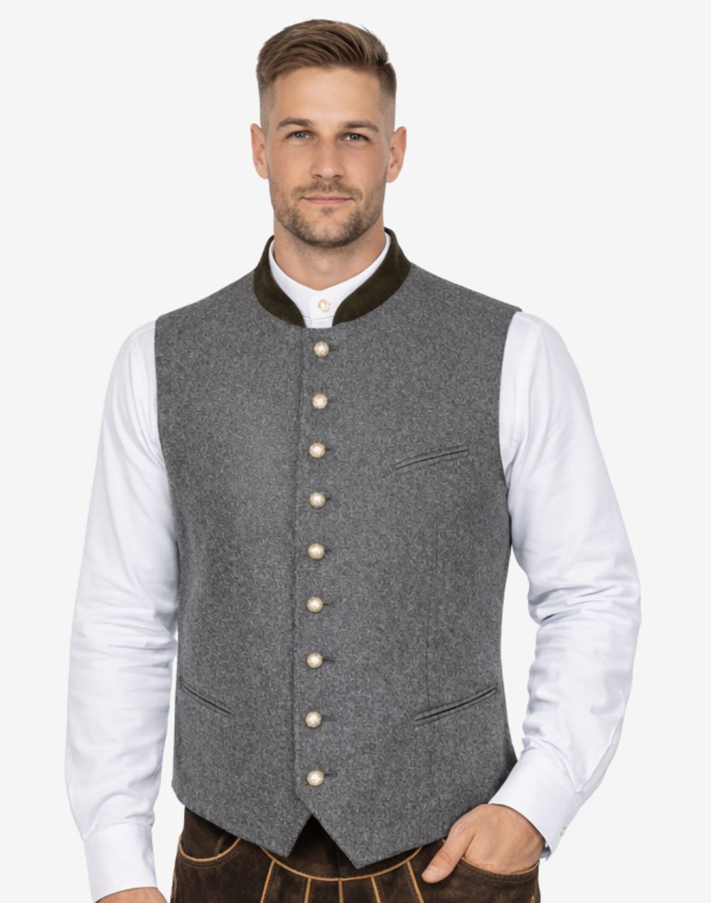 Model wearing mens authentic Alpine vest with grey wool fabric paired with traditional shirt and lederhosen.