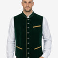 Model wearing mens Bavarian heritage vest styled with traditional shirt and lederhosen for classic Oktoberfest outfit.