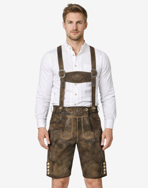Model wearing mens Bavarian leather shorts with traditional suspenders and embroidered Oktoberfest lederhosen